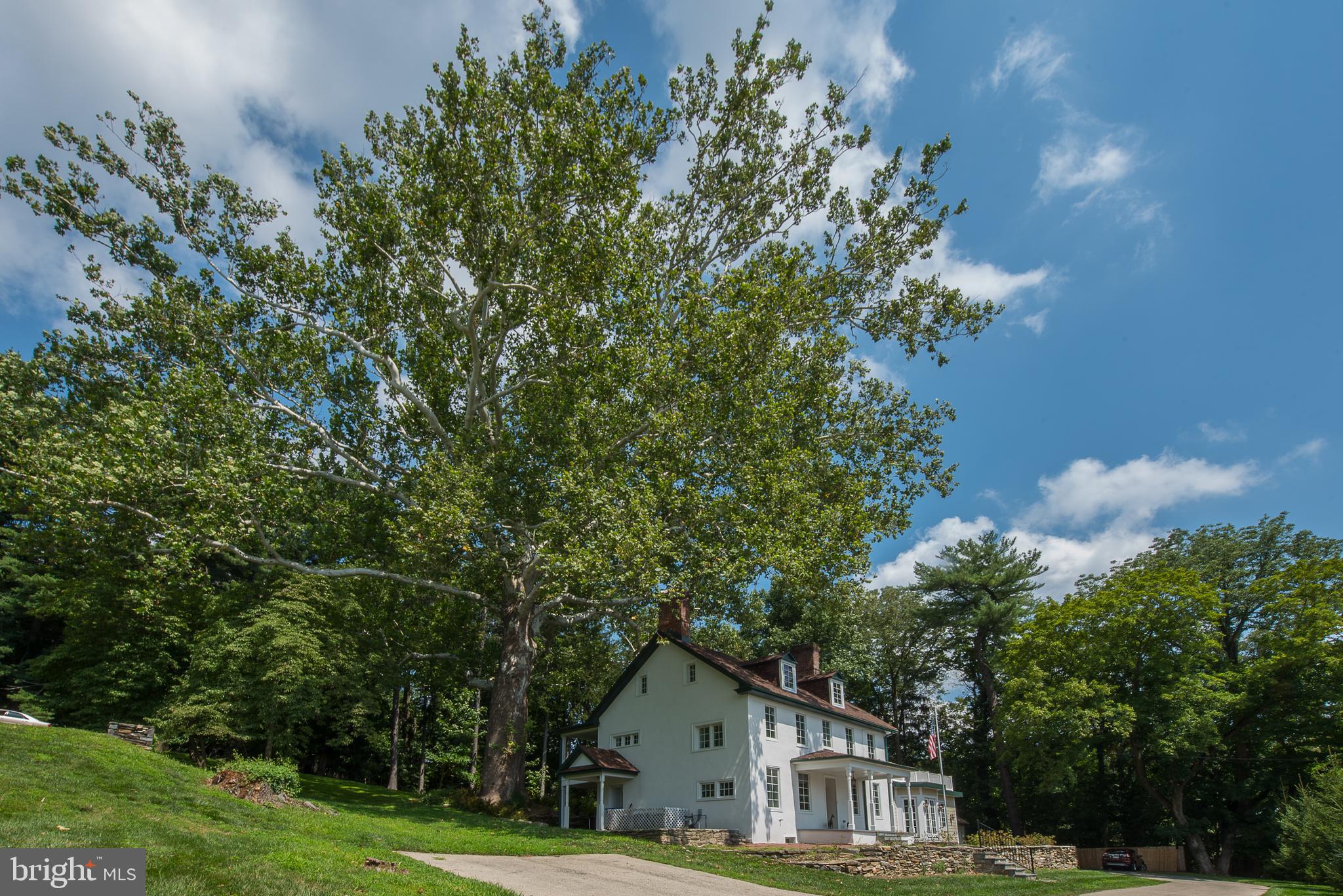 603 Beatty Road Media, PA 19063 - Photo 2 of 84 a house with green field in front of it