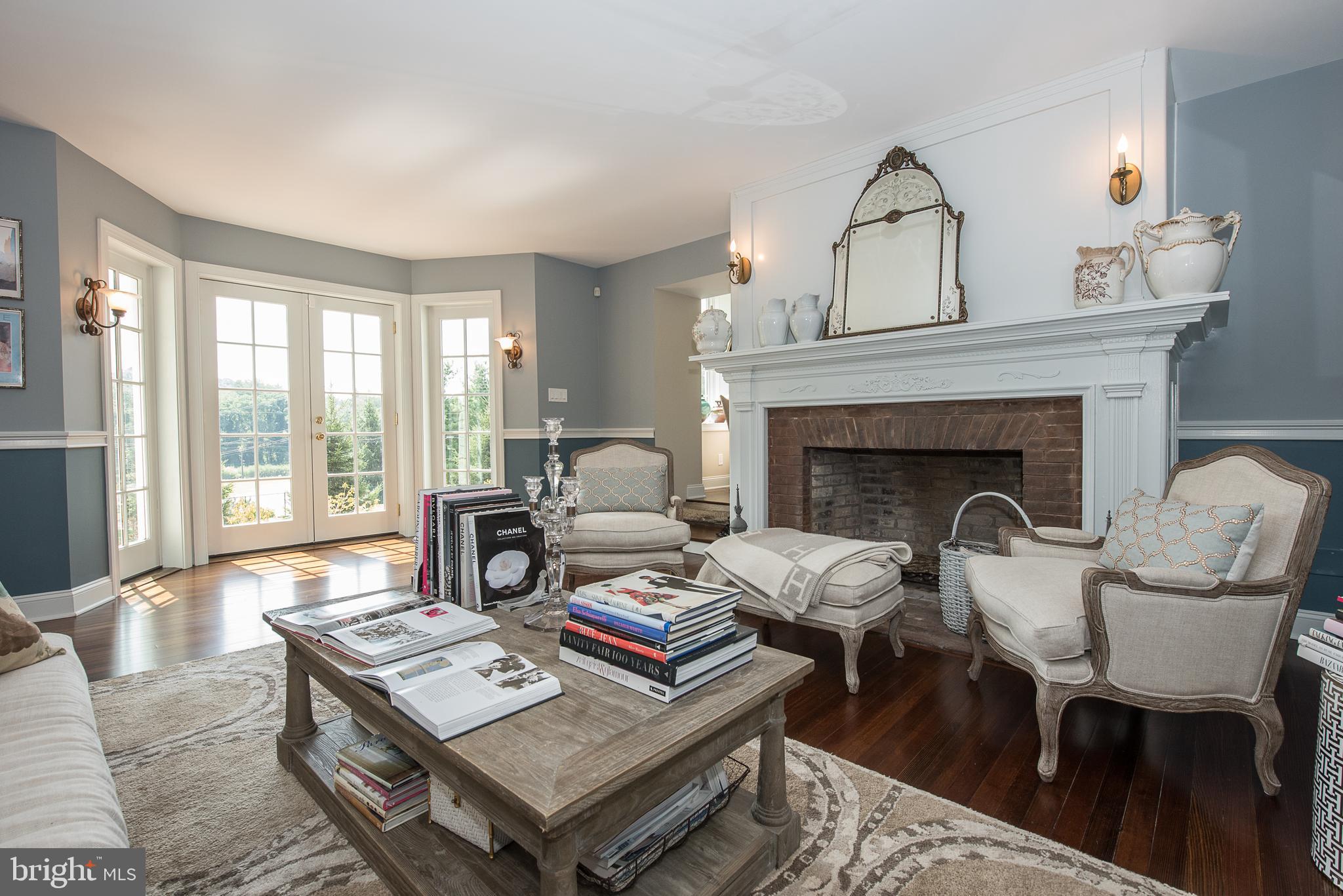 603 Beatty Road Media, PA 19063 - Photo 21 of 84 a living room with furniture and a fireplace