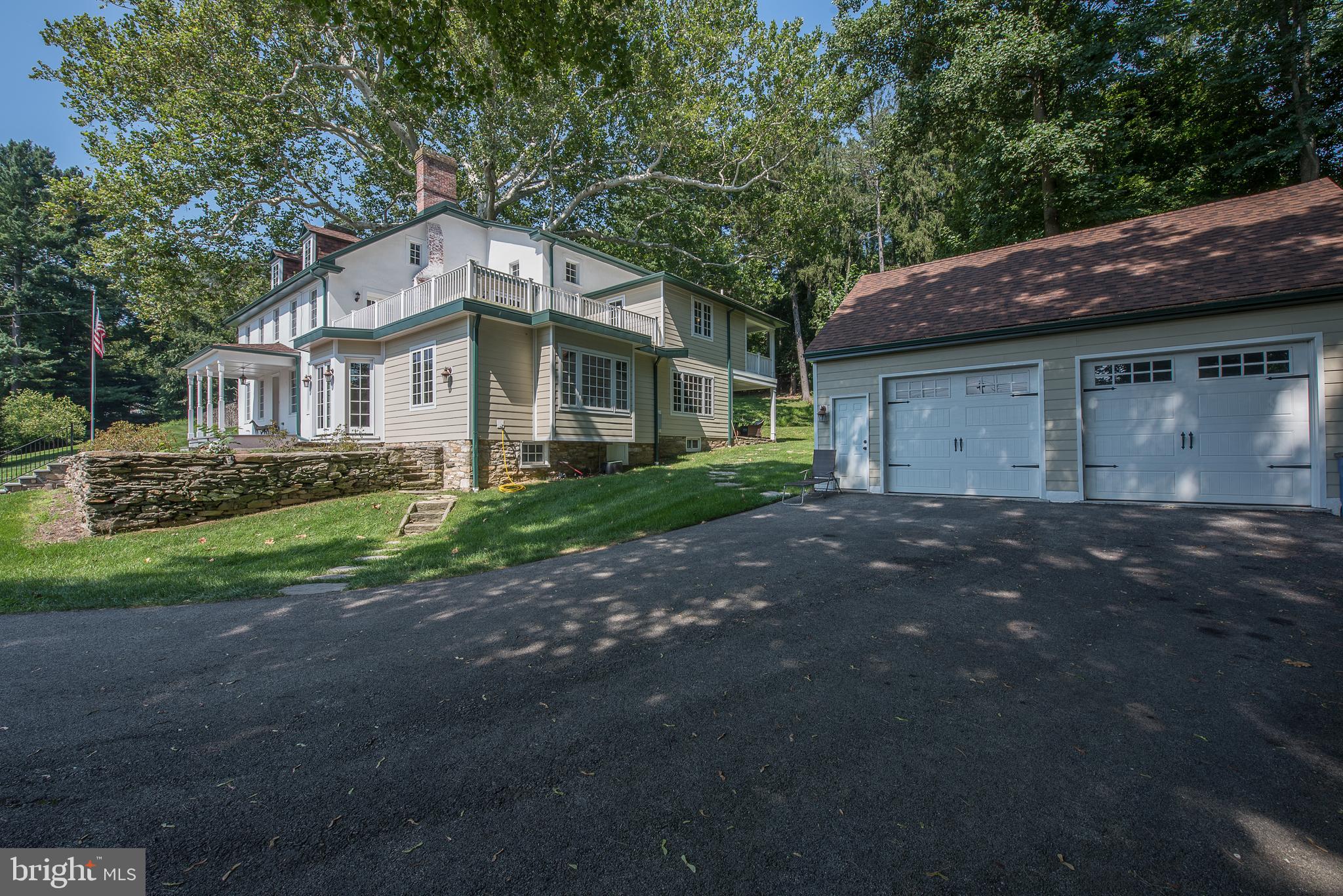 603 Beatty Road Media, PA 19063 - Photo 3 of 84 a front view of a house with a garden
