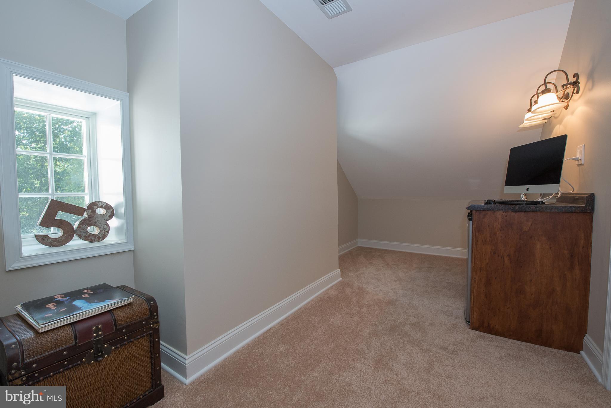 603 Beatty Road Media, PA 19063 - Photo 44 of 84 a room with a flat screen tv and a window
