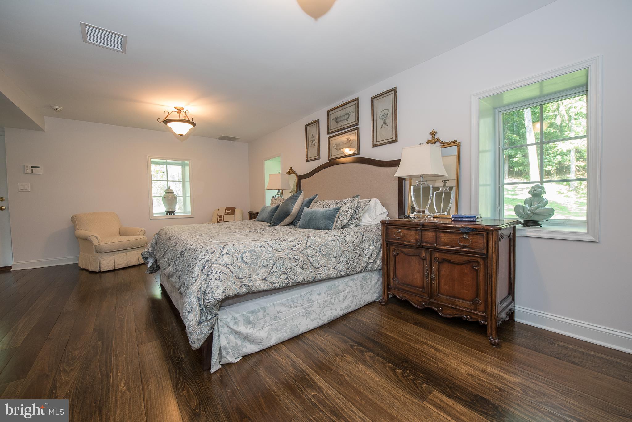 603 Beatty Road Media, PA 19063 - Photo 49 of 84 a bedroom with a bed and wooden floor
