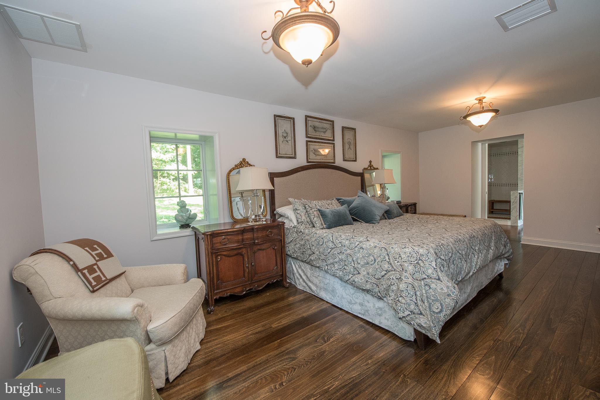 603 Beatty Road Media, PA 19063 - Photo 51 of 84 a bedroom with a bed and window with chair