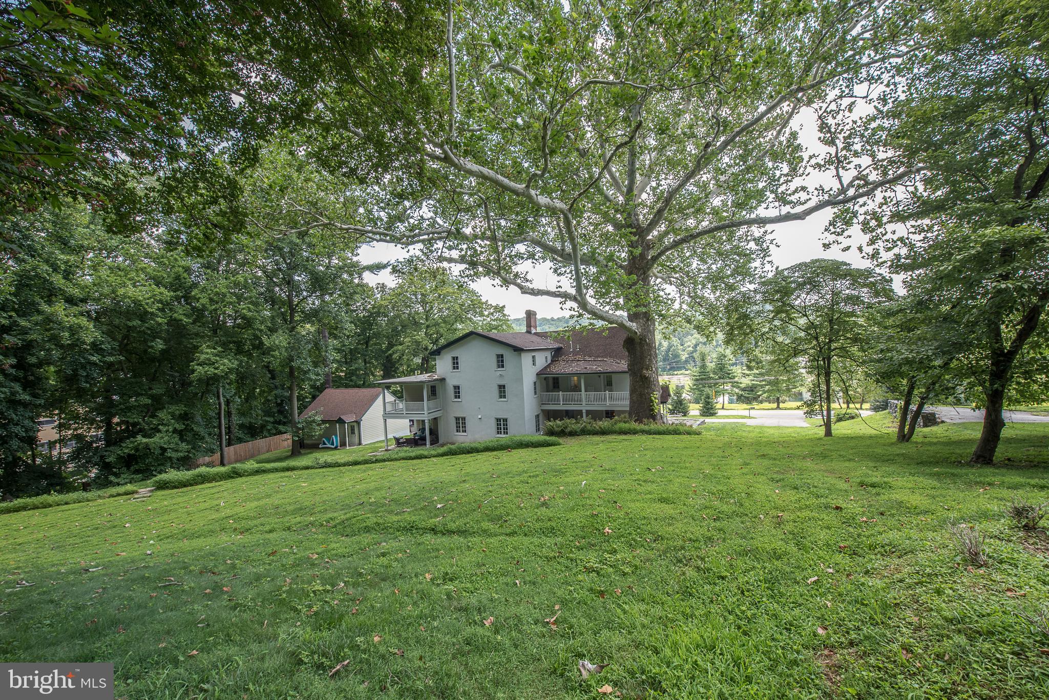 603 Beatty Road Media, PA 19063 - Photo 70 of 84 a view of a house with a big yard and large trees
