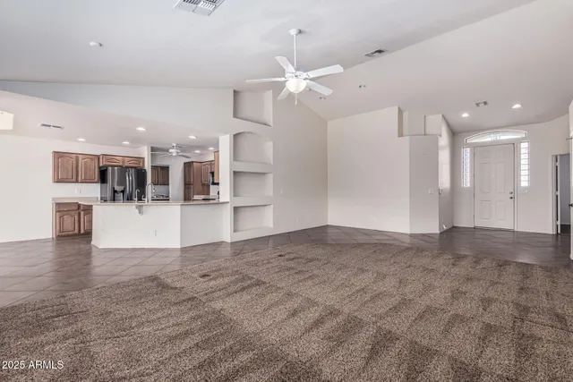 a view of a living room and kitchen with a sink