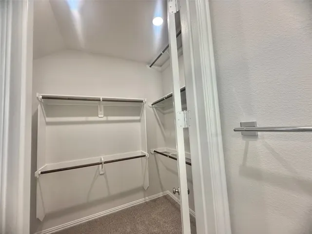 a view of an empty walk in closet