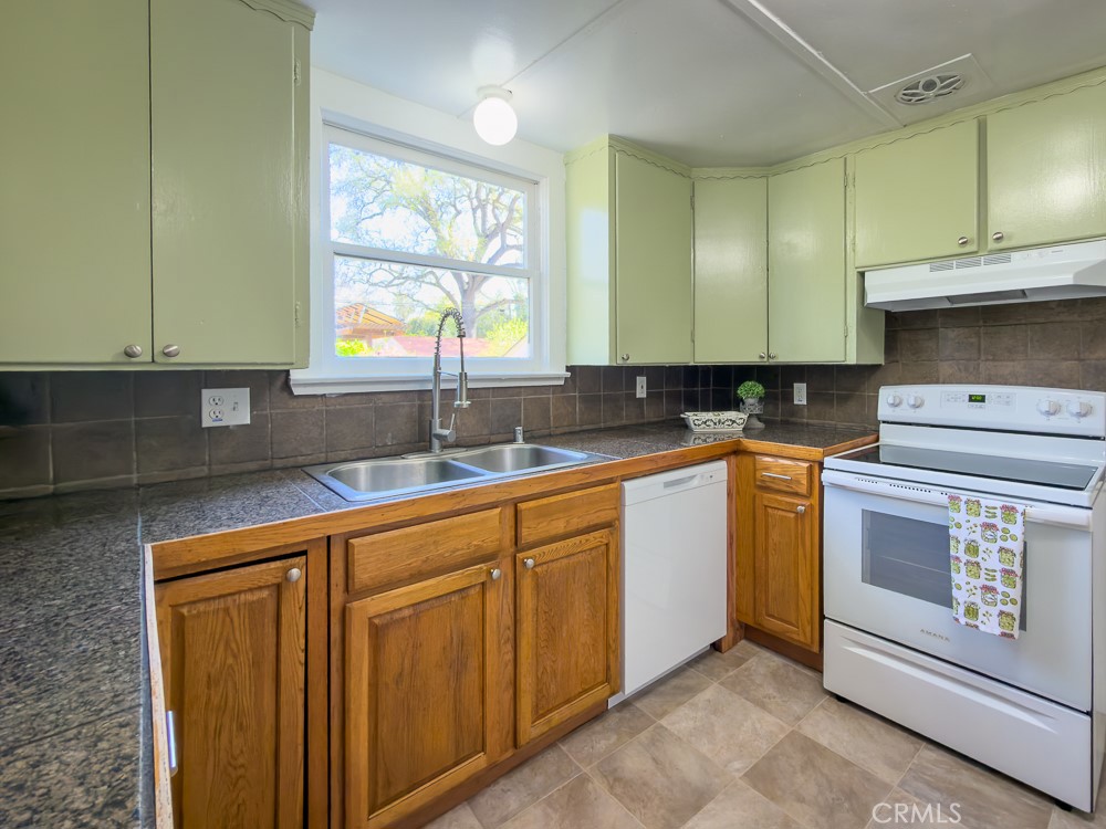 243 West 3rd Avenue Chico, CA 95926 - Photo 17 of 41 a kitchen with granite countertop cabinets stainless steel appliances a sink and window