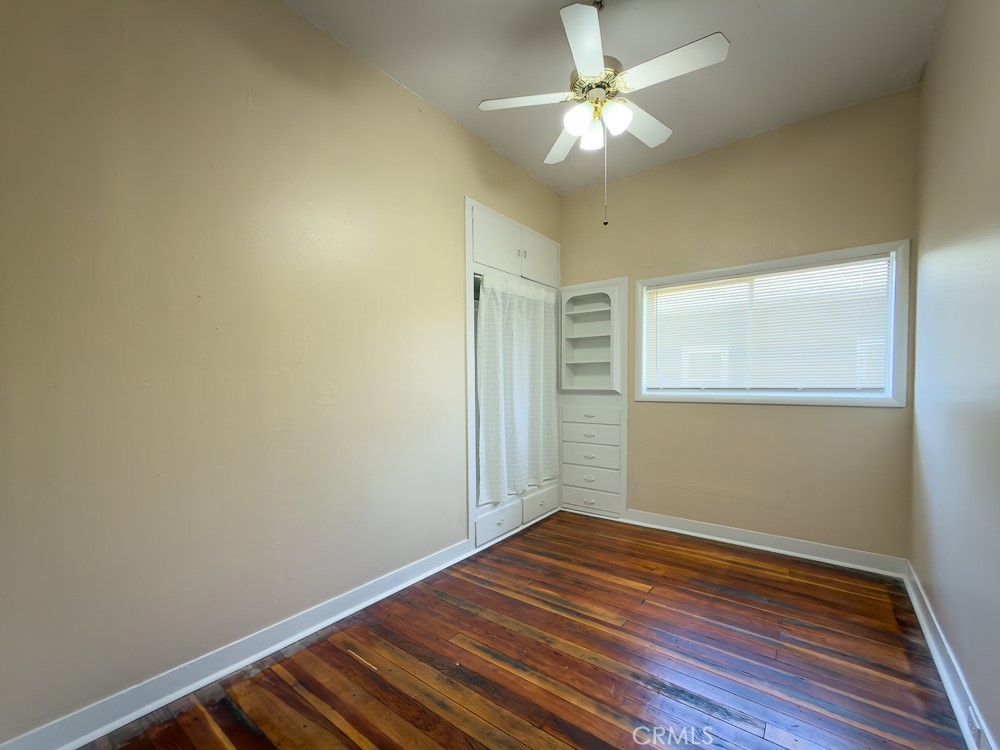 243 West 3rd Avenue Chico, CA 95926 - Photo 18 of 41 an empty room with wooden floor fan and windows