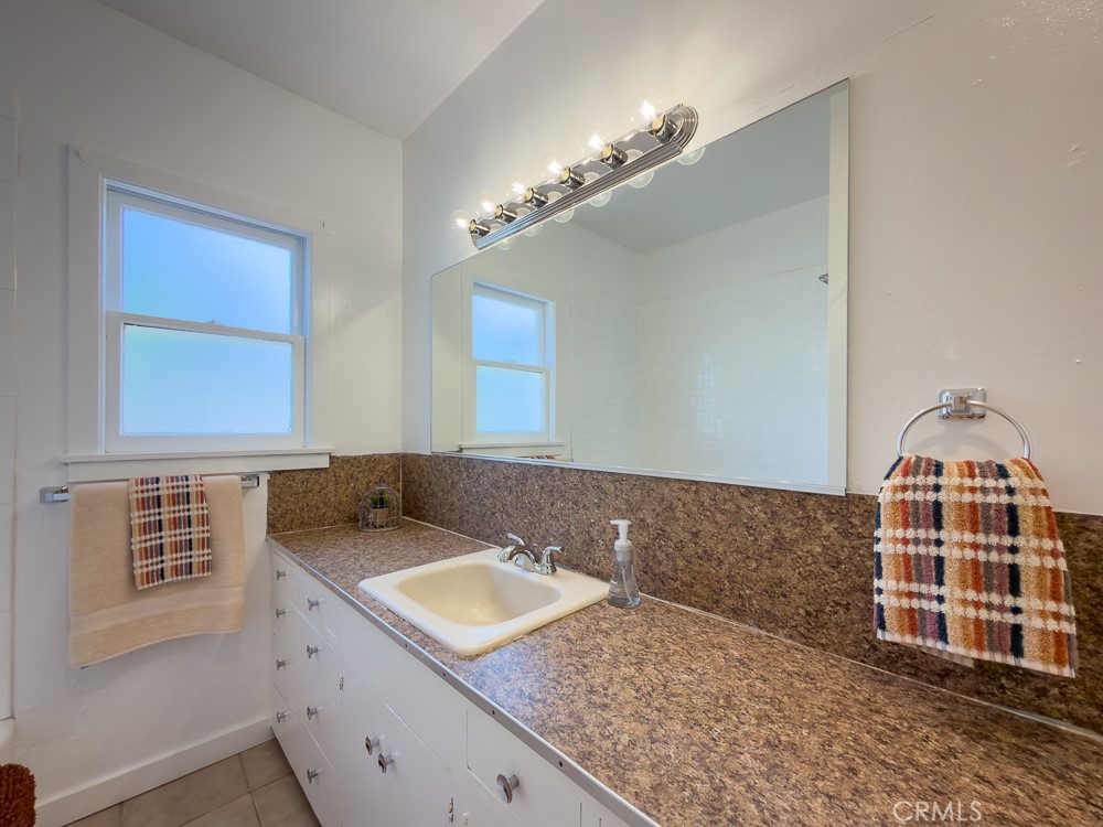 243 West 3rd Avenue Chico, CA 95926 - Photo 19 of 41 a bathroom with a sink and a mirror