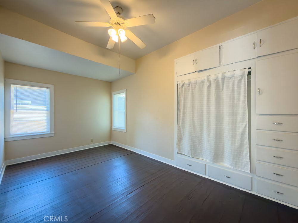 243 West 3rd Avenue Chico, CA 95926 - Photo 5 of 41 an empty room with wooden floor fan and windows