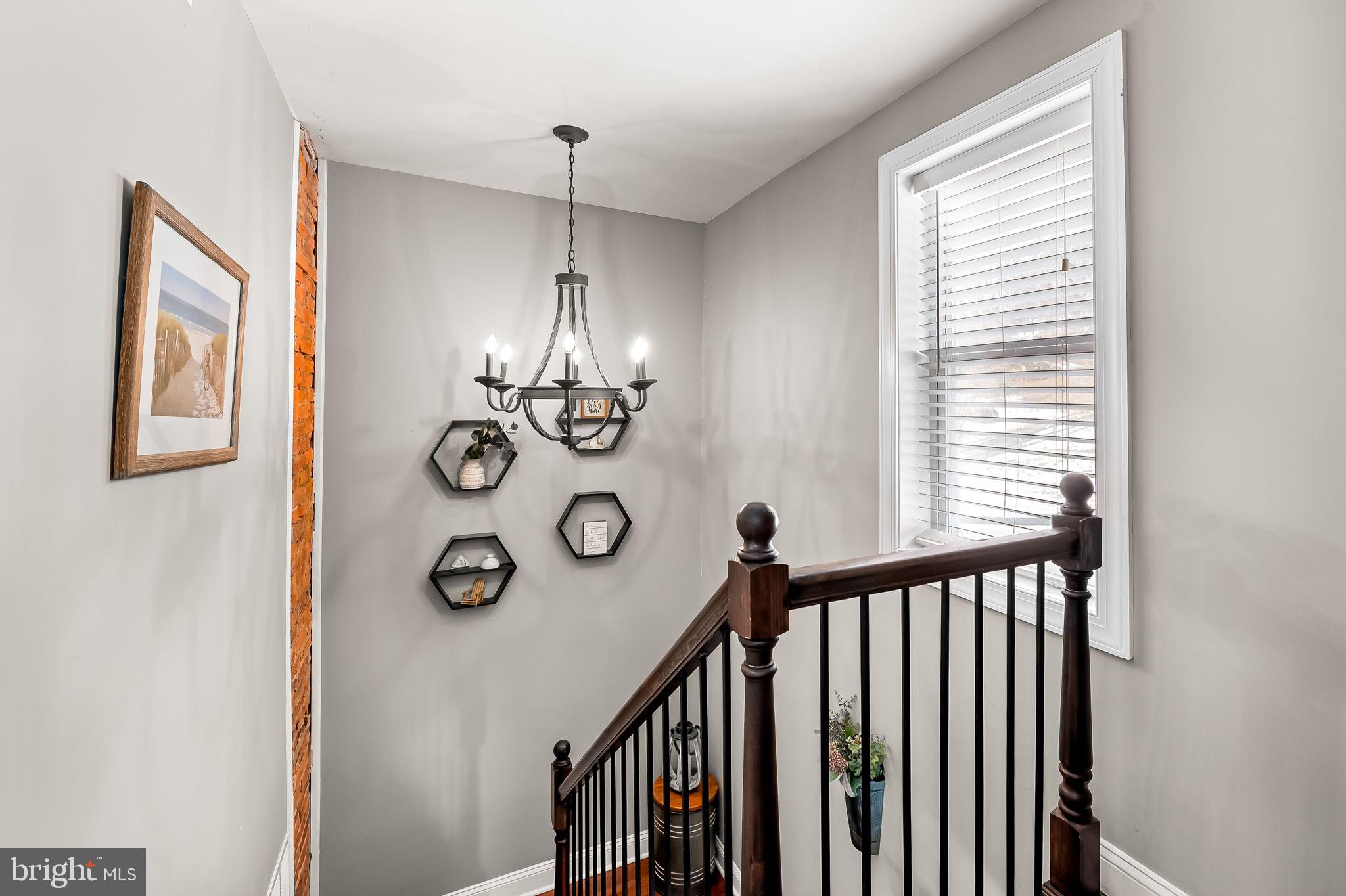 16546 Trenton Road Upperco, MD 21155 - Photo 18 of 30 Upstairs stairwell with brick accent wall