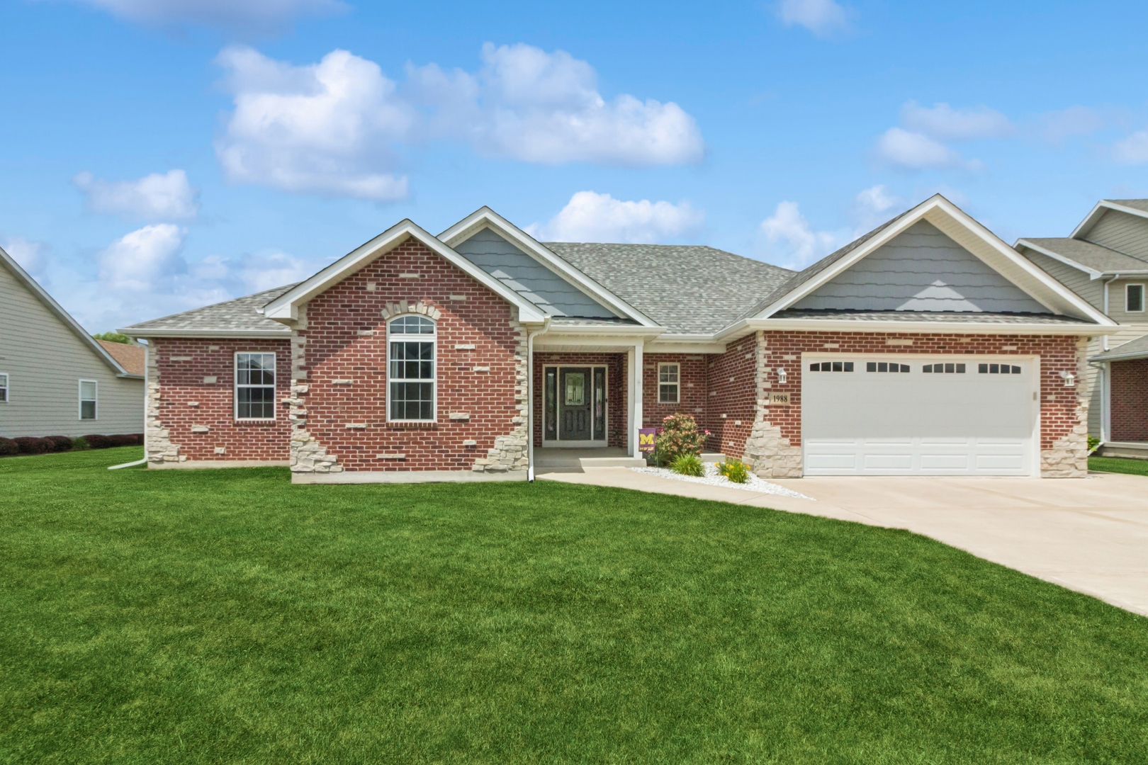 1988 Taller Road Morris, IL 60450 - Photo 1 of 24 a front view of a house with a garden and yard