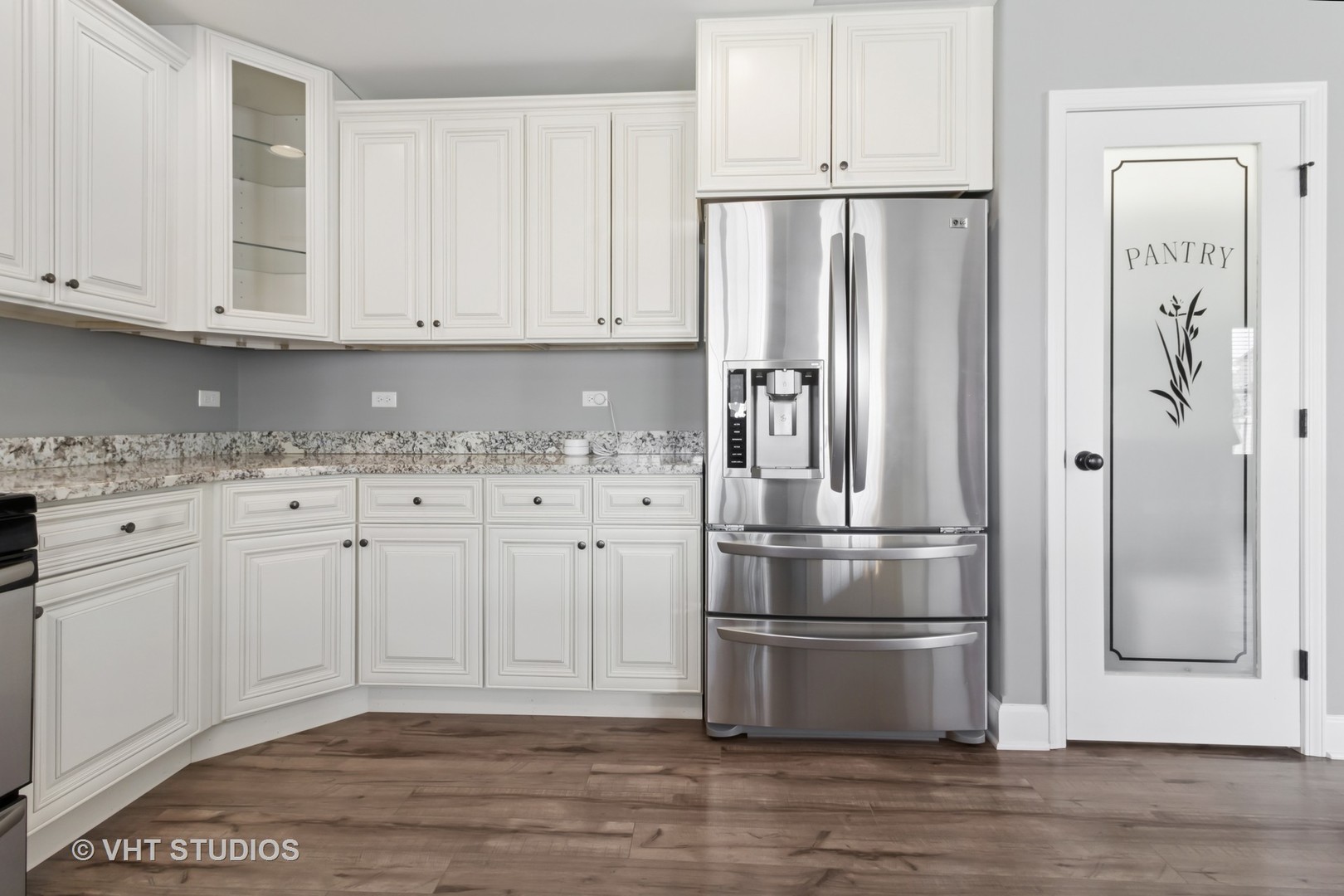 1988 Taller Road Morris, IL 60450 - Photo 9 of 24 a kitchen with granite countertop a refrigerator and cabinets
