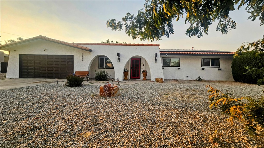 19994 Shoshonee Road Apple Valley, CA 92307 - Photo 1 of 1 a front view of a house with garden