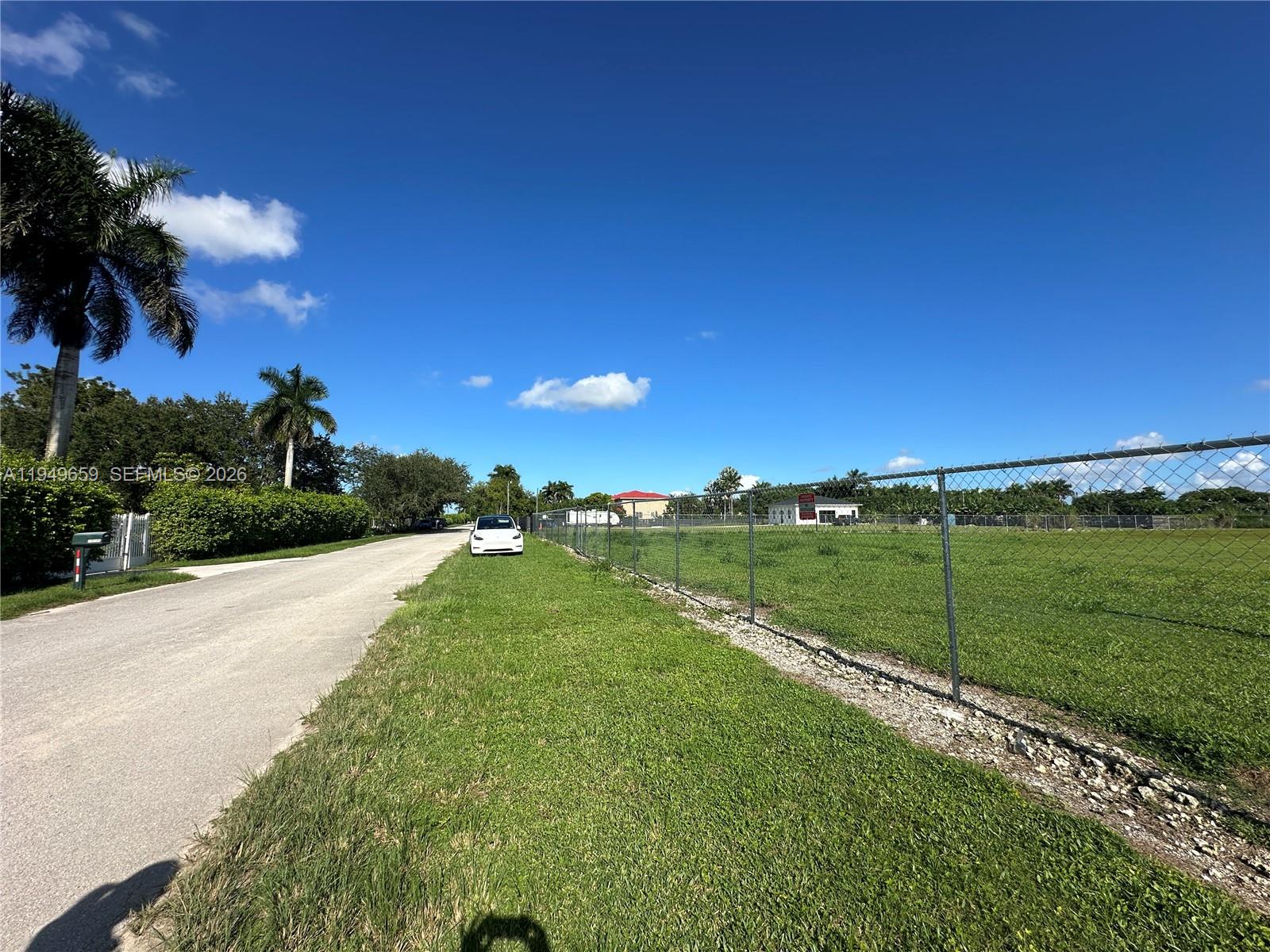 19690 Southwest 206th Street Miami, FL 33187 - Photo 14 of 24 a view of a golf course with a lake