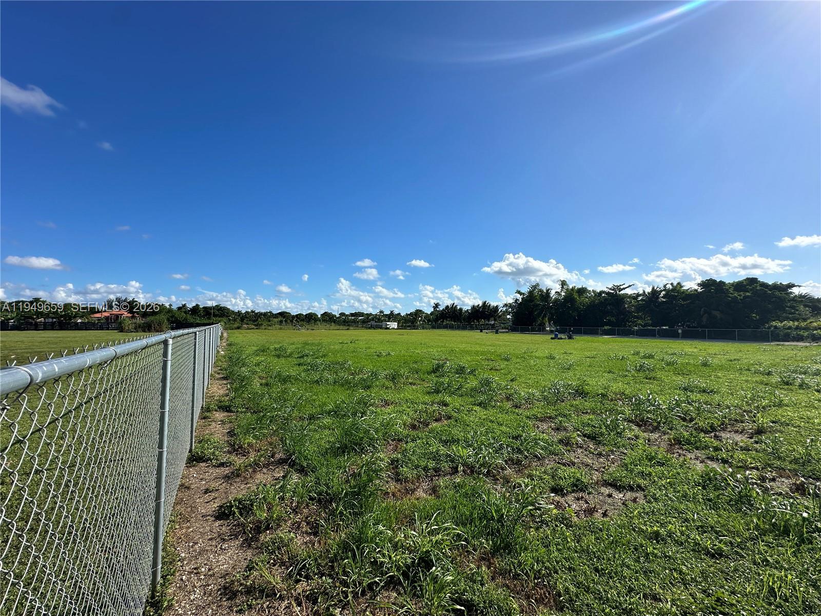 19690 Southwest 206th Street Miami, FL 33187 - Photo 6 of 24 a view of an outdoor space and a yard