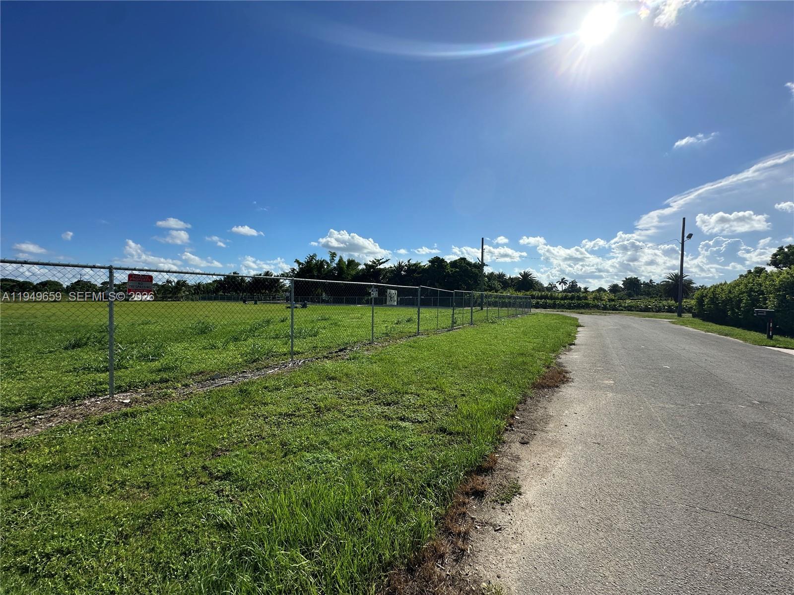19690 Southwest 206th Street Miami, FL 33187 - Photo 9 of 24 a view of a golf course with a lake