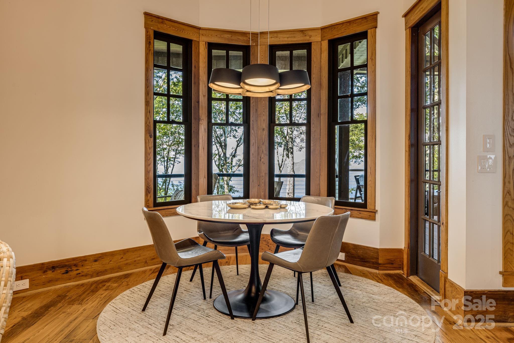 85 Back Bone Way, Unit 200 Sylva, NC 28779 - Photo 14 of 48 a view of a dining room with furniture and window