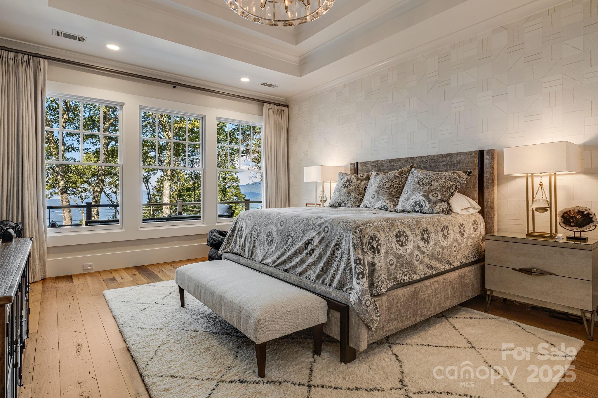 85 Back Bone Way, Unit 200 Sylva, NC 28779 - Photo 19 of 48 a spacious bedroom with a large bed and a large window