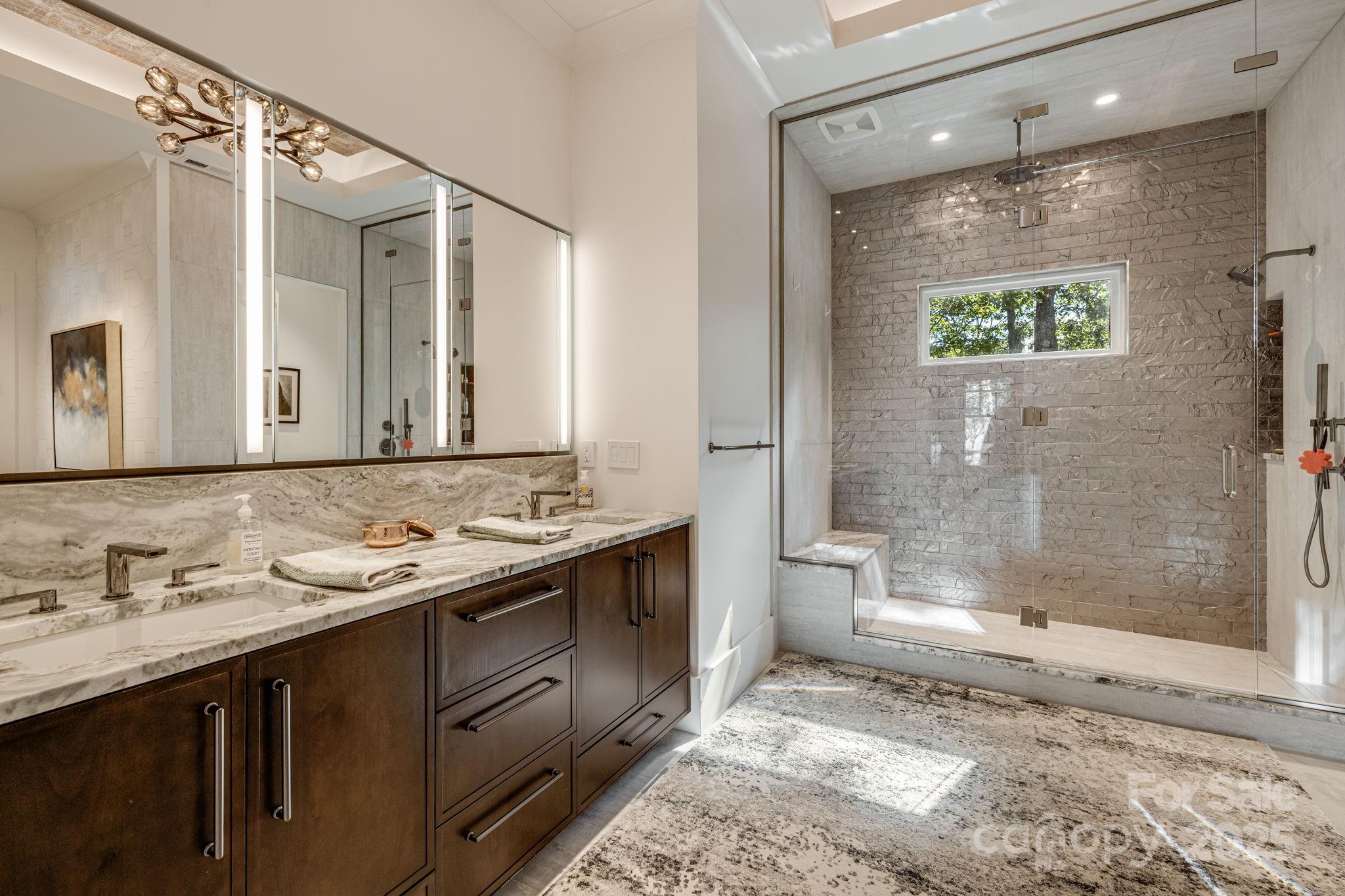 85 Back Bone Way, Unit 200 Sylva, NC 28779 - Photo 21 of 48 a bathroom with a granite countertop sink mirror and a bathtub
