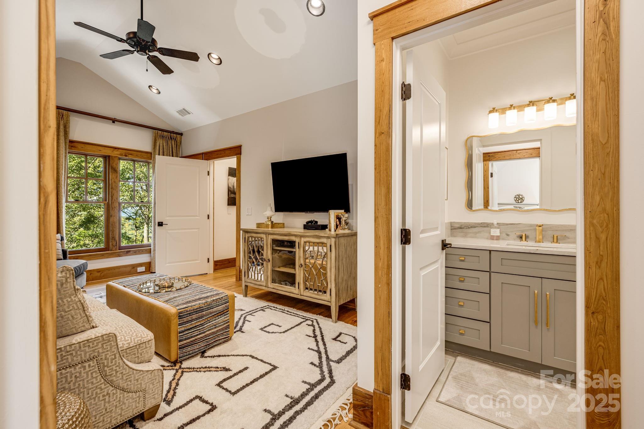 85 Back Bone Way, Unit 200 Sylva, NC 28779 - Photo 26 of 48 a living room with furniture and a flat screen tv