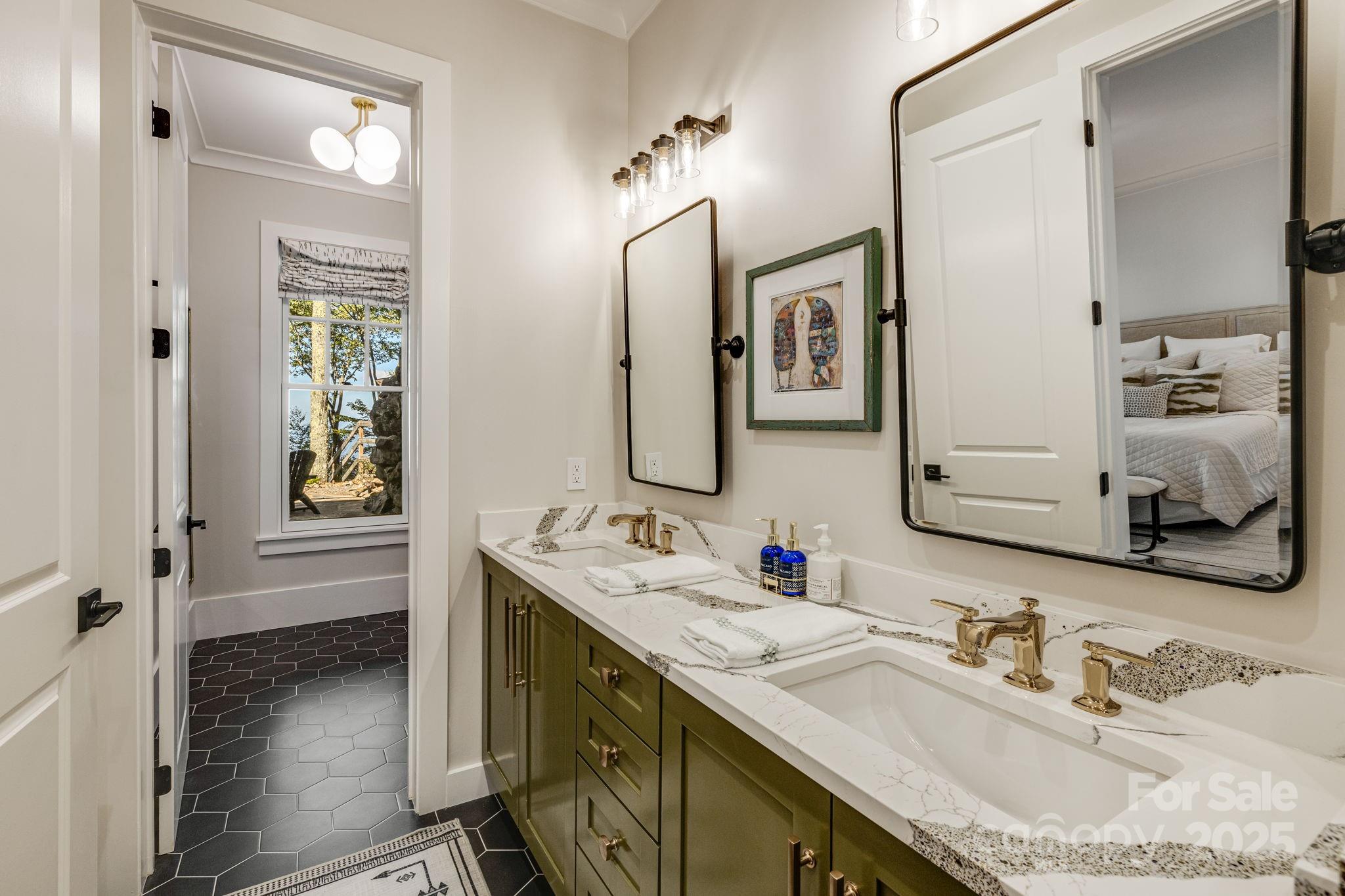 85 Back Bone Way, Unit 200 Sylva, NC 28779 - Photo 40 of 48 a bathroom with a granite countertop sink vanity and mirror