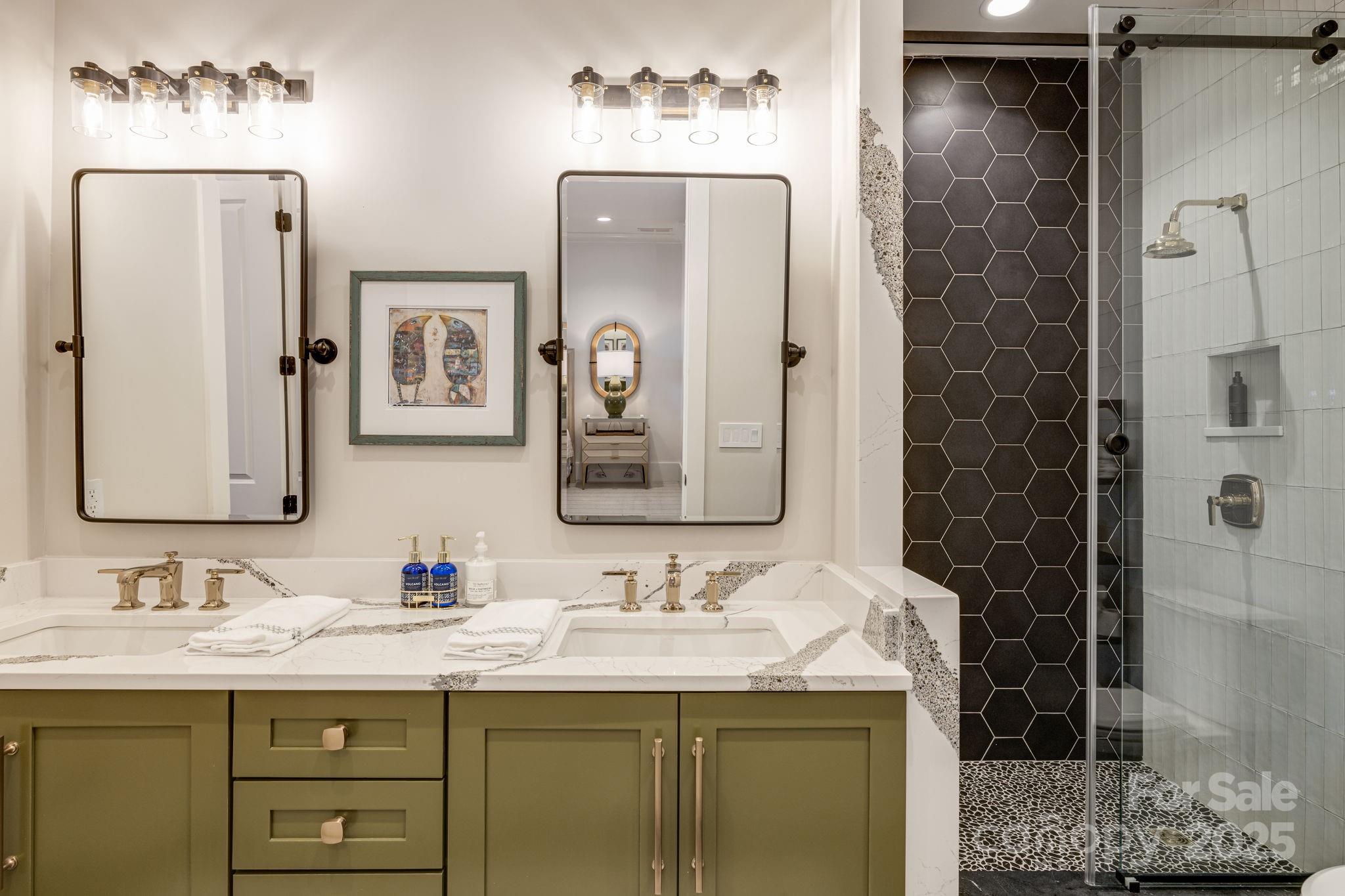 85 Back Bone Way, Unit 200 Sylva, NC 28779 - Photo 41 of 48 a bathroom with a granite countertop sink and mirror