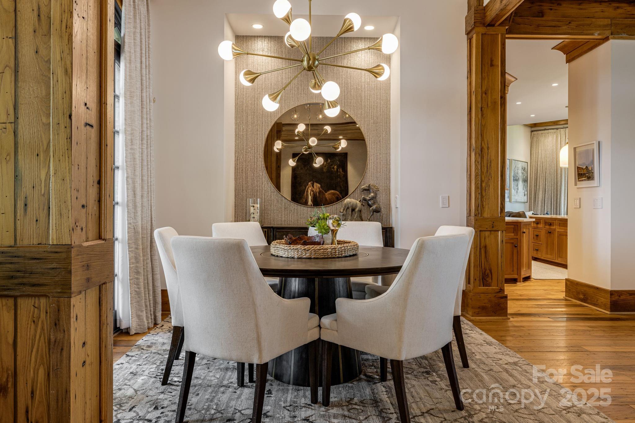 85 Back Bone Way, Unit 200 Sylva, NC 28779 - Photo 8 of 48 a view of a dining room with furniture and wooden floor