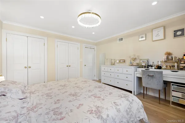 a bedroom with a bed and a cabinets