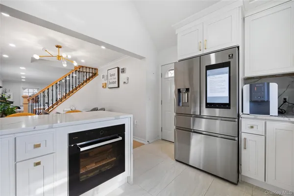 a kitchen with cabinets and stainless steel appliances