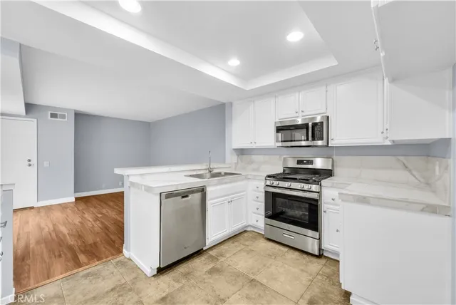 a kitchen with a stove and a microwave