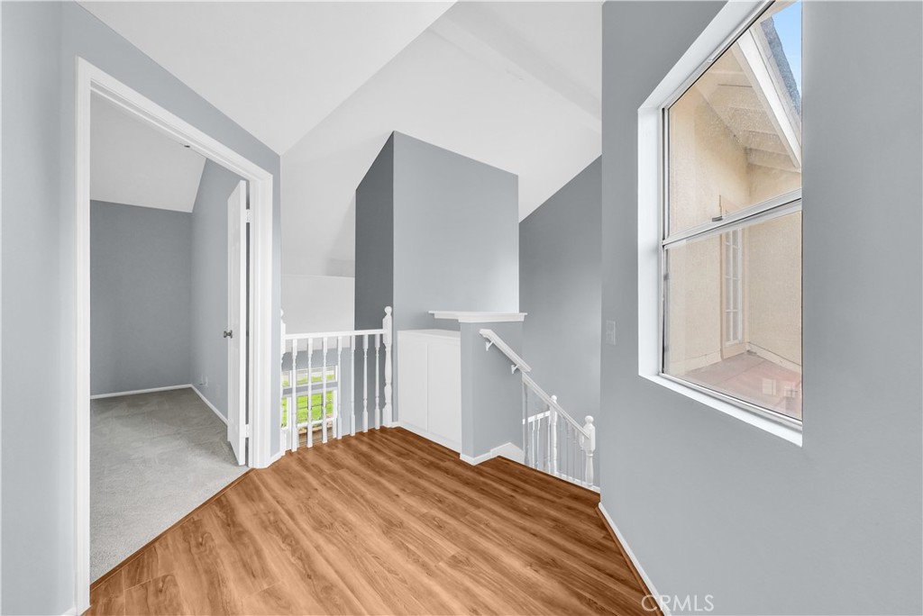 4 Wellesley Irvine, CA 92612 - Photo 13 of 24 a view of a bedroom with wooden floor and window