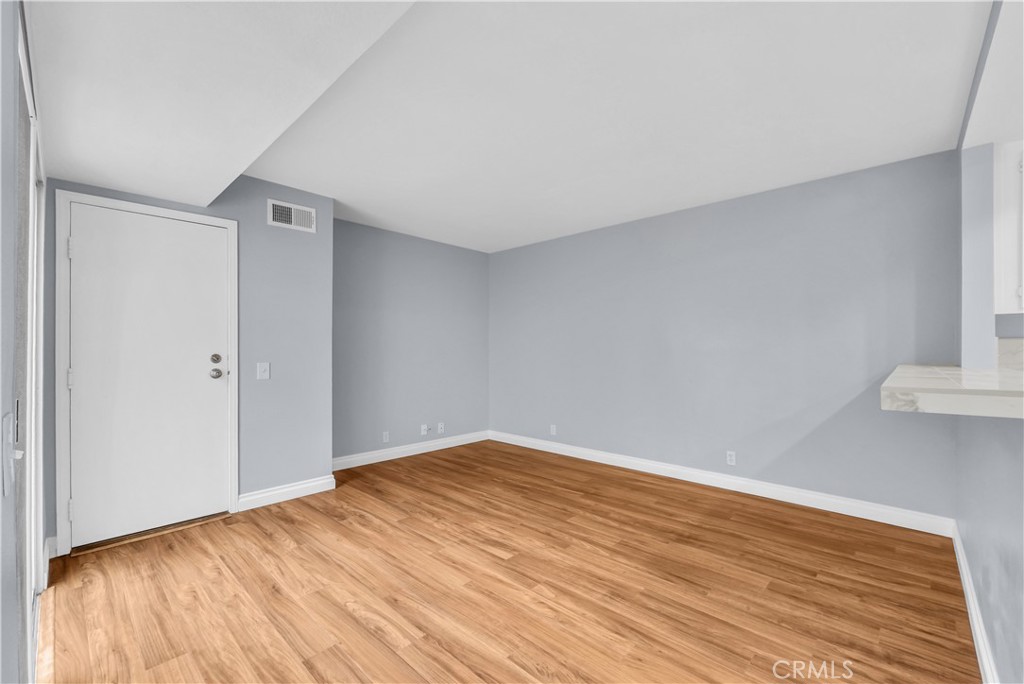 4 Wellesley Irvine, CA 92612 - Photo 14 of 24 a view of empty room with wooden floor