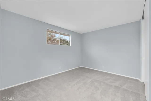 a view of room with window and closet