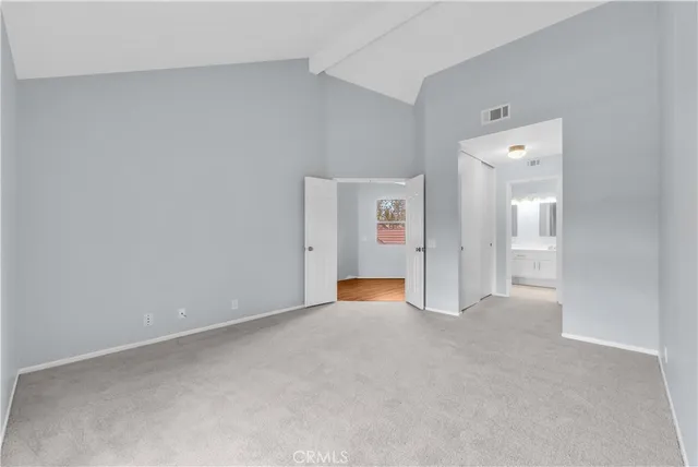 an empty room with a bathroom