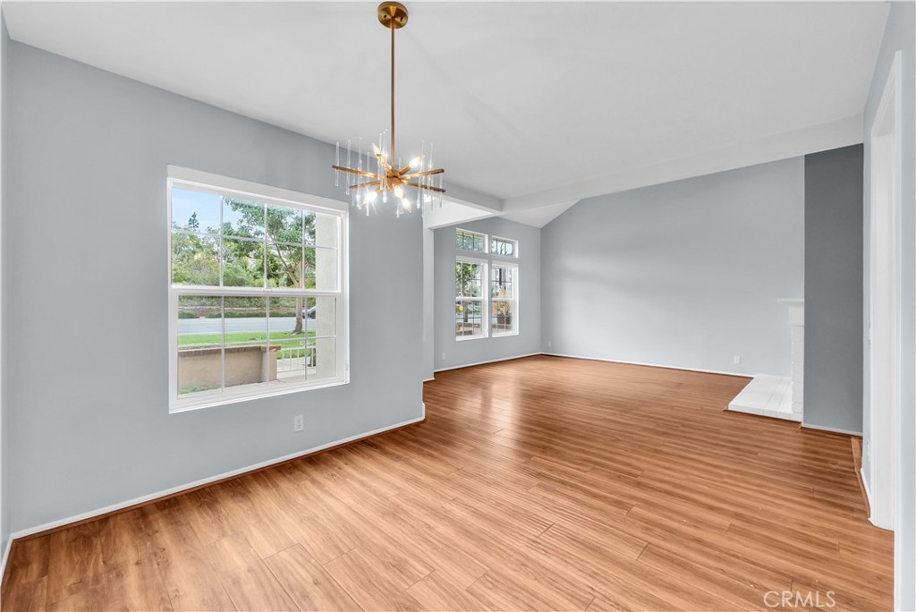 4 Wellesley Irvine, CA 92612 - Photo 8 of 24 a view of an empty room with wooden floor and a window