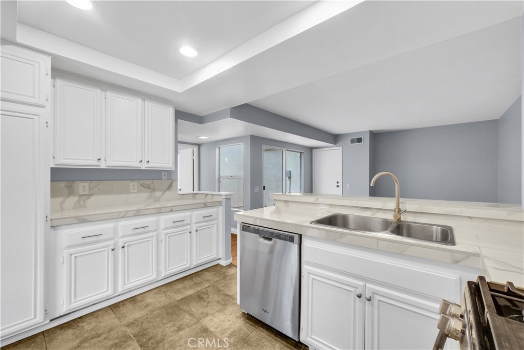 4 Wellesley Irvine, CA 92612 - Photo 10 of 24 a kitchen with sink and cabinets