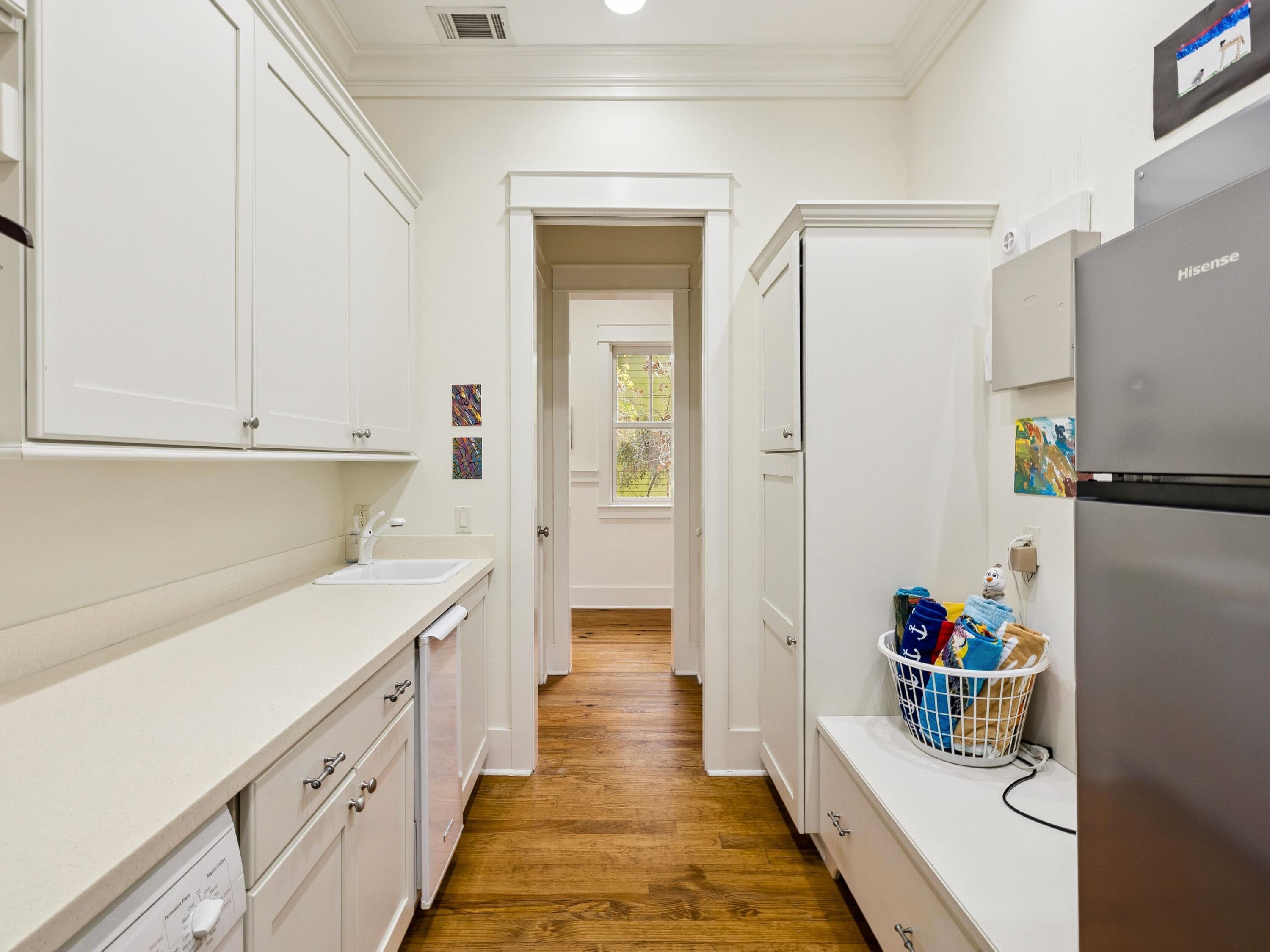 30 Tall Timber Court Santa Rosa Beach, FL 32459 - Photo 23 of 60 a kitchen with a refrigerator and white cabinets