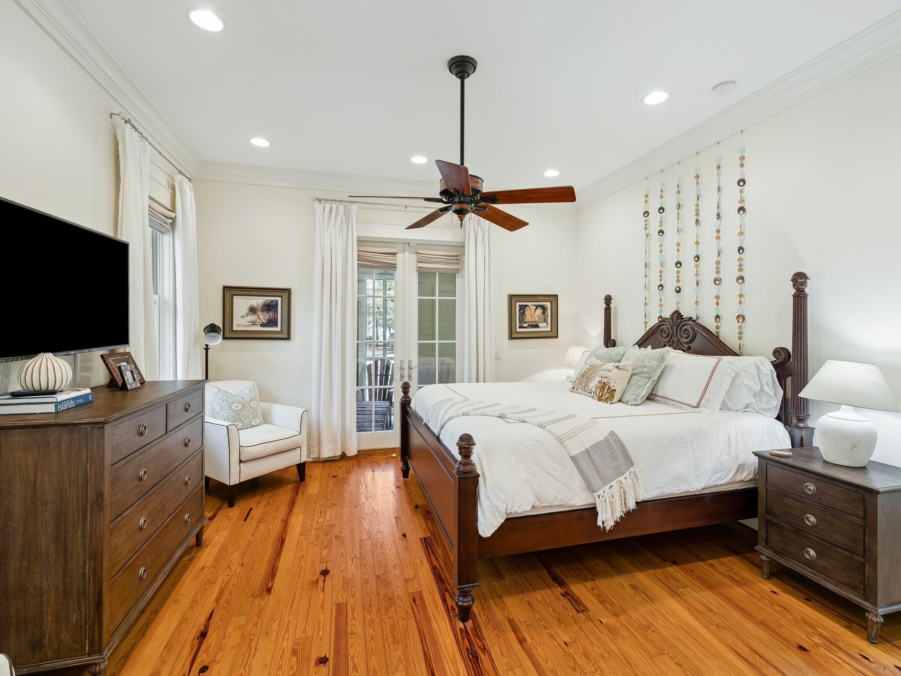 30 Tall Timber Court Santa Rosa Beach, FL 32459 - Photo 42 of 60 a bedroom with a bed and wooden floor