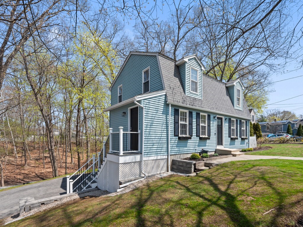 2 Stringer Dam Road Shrewsbury, MA 01545 - Photo 2 of 35 a view of a house with a yard chairs and floor to ceiling window