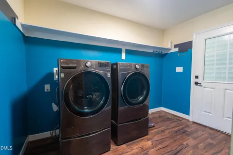 a bathroom with a granite countertop sink a mirror and a shower