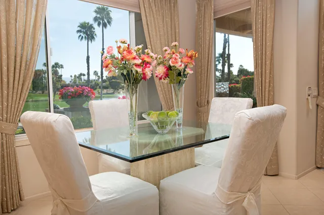 a view of a dining room with furniture window and outdoor view
