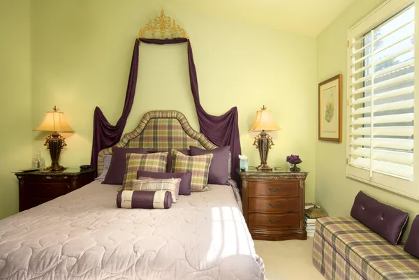 a bedroom with a bed dresser and a window