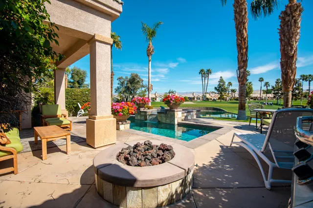 a view of a patio with couches chairs dining table and chairs