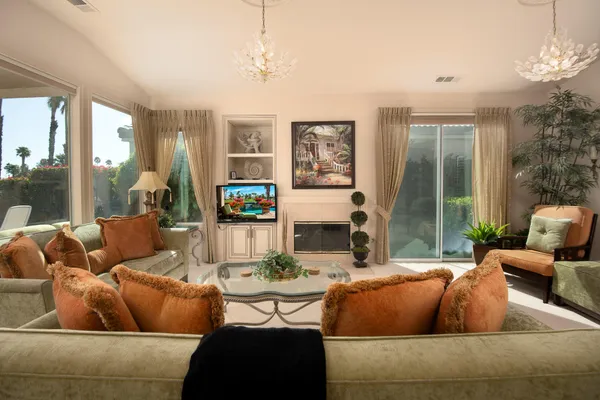 a living room with furniture and a large window