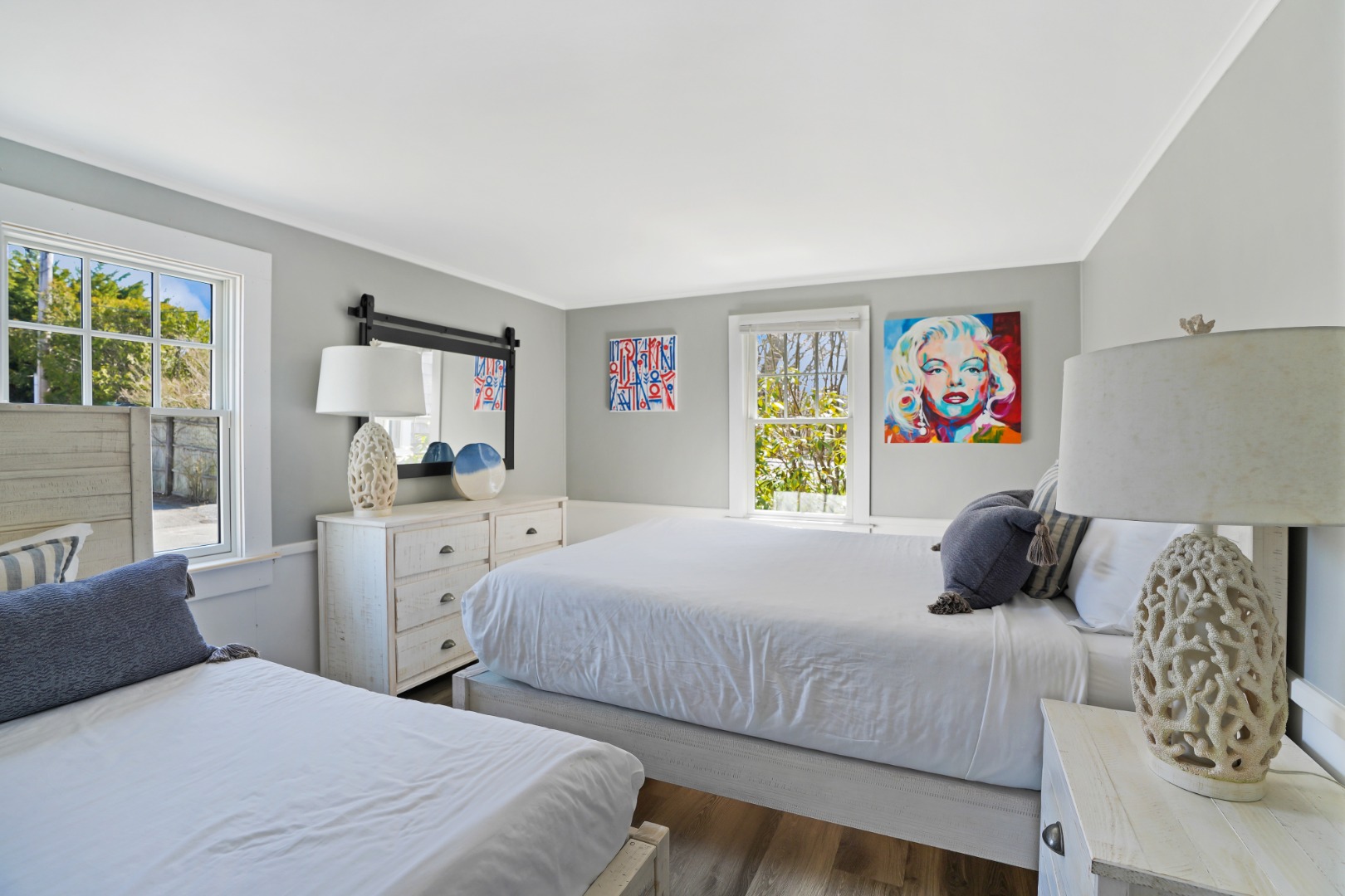 20 Peases Point Way North, Unit 4 Edgartown, MA 02539 - Photo 6 of 11 a bedroom with two beds and a large window