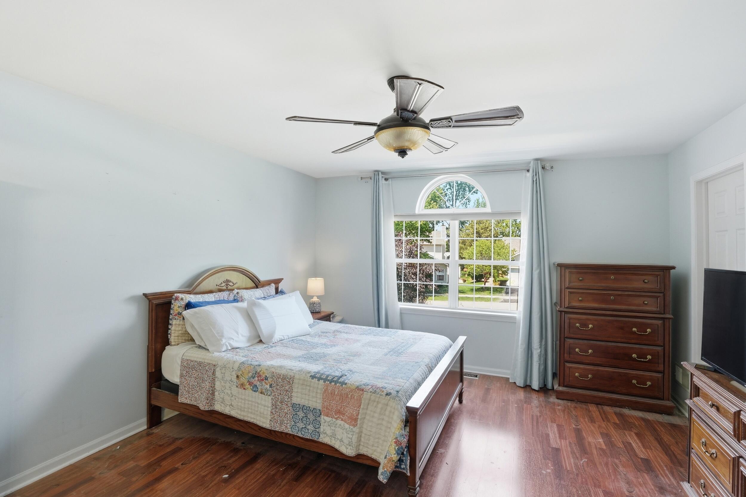 2184 Timberidge Lane Highland, IN 46322 - Photo 14 of 18 a bedroom with a bed dresser and a window