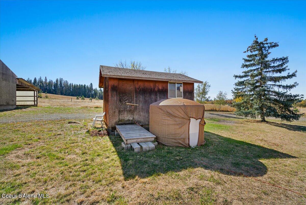 15200 North Rimrock Road Hayden, ID 83835 - Photo 36 of 45 36-Shed and water tank