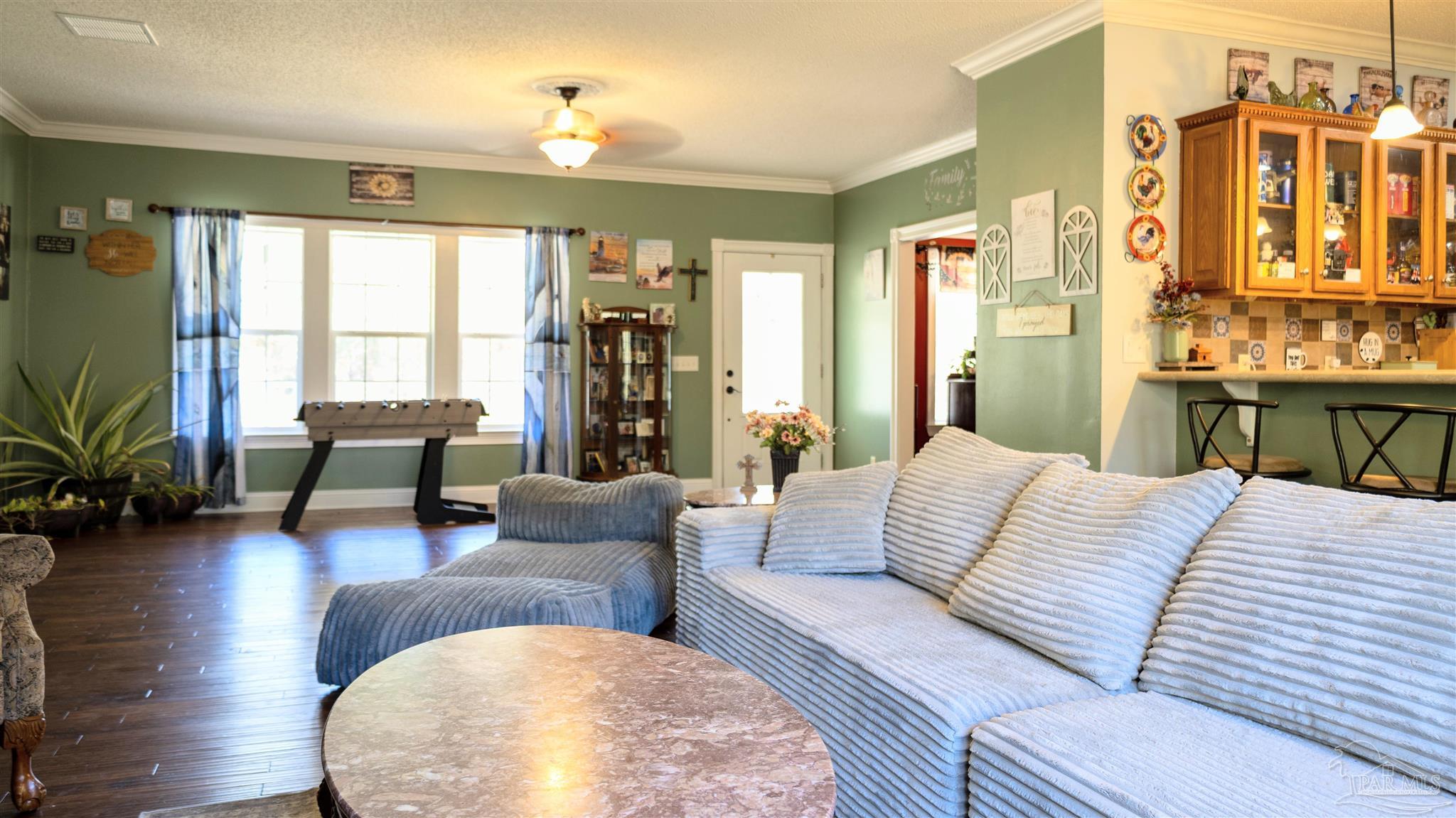 1700 Prospect Road Coffeeville, AL 36524 - Photo 12 of 71 a living room with furniture and a large window