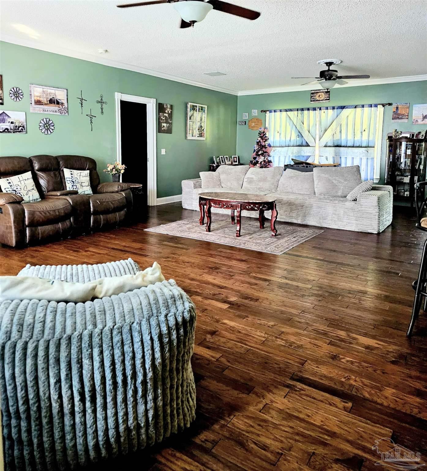 1700 Prospect Road Coffeeville, AL 36524 - Photo 15 of 71 a living room with furniture and a large window