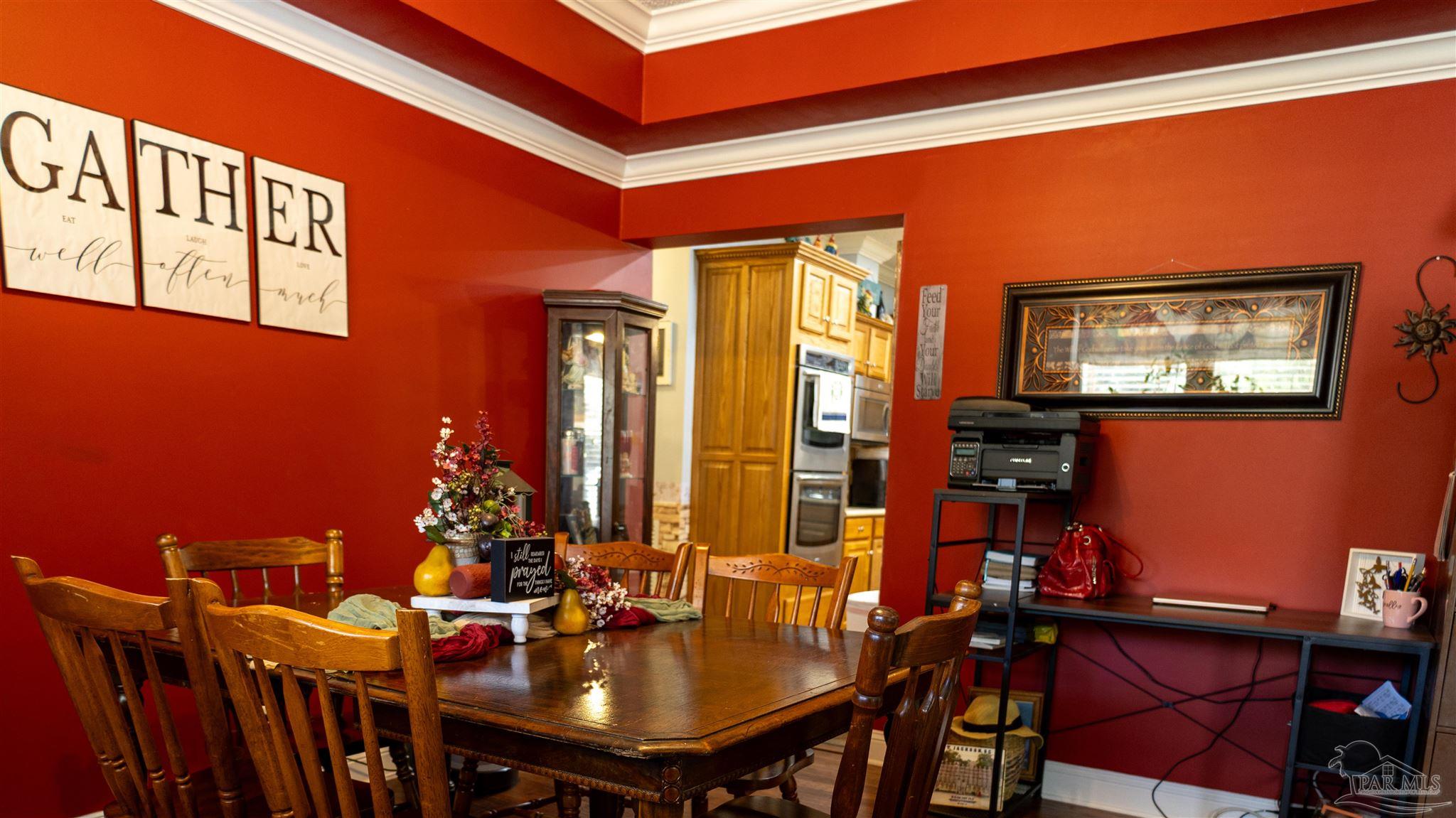 1700 Prospect Road Coffeeville, AL 36524 - Photo 18 of 71 a view of a dining room with furniture and chandelier